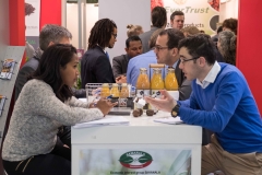 Organic Africa Pavilion in 2018 at BioFach exhibitor talking to buyers