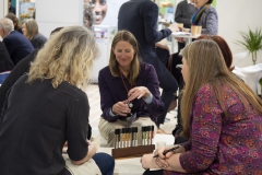 Organic Africa Pavilion in 2019 at BioFach exhibitor talking to buyers